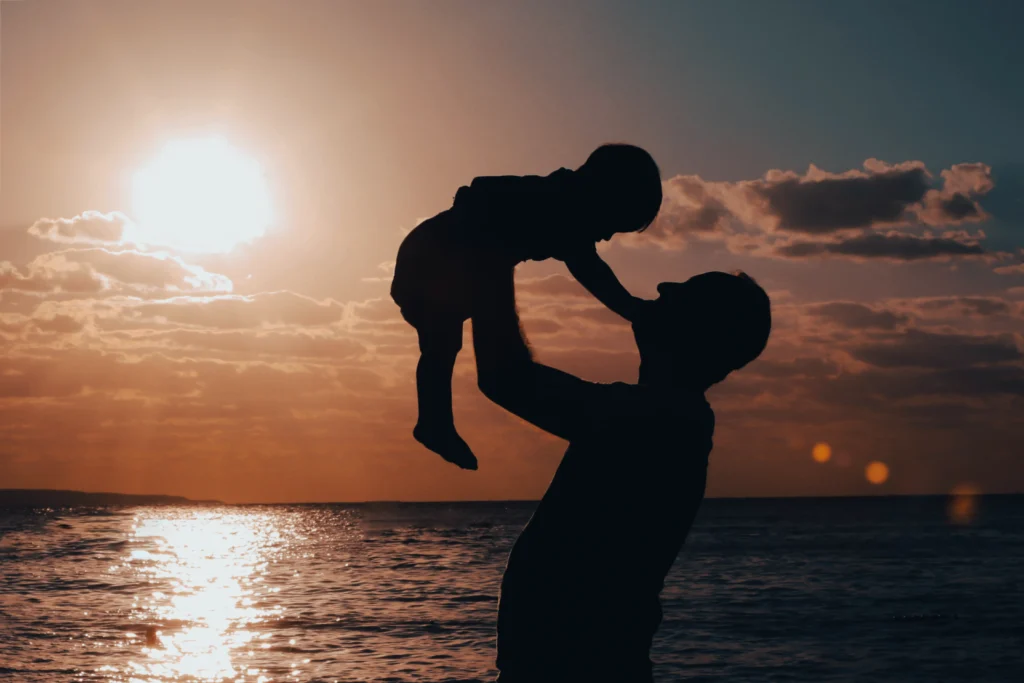silhouette father child sunset